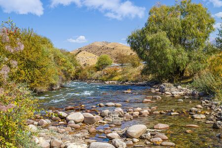 Stones in a mountain river landscape. Water in a stormy mountain riverの写真素材