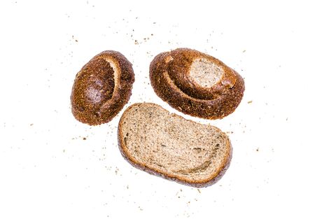 Sliced rye bread with crumbs on a white background. Selective focus.の写真素材