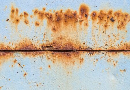 Old rusty painted metal surface as backgroundの写真素材
