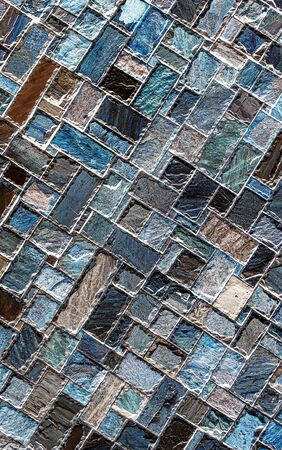 Wall of colored artificial stone as a background.の写真素材