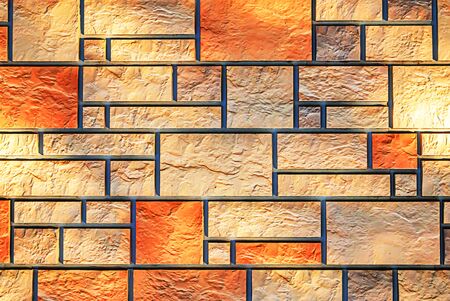 Wall of colored artificial stone as a background.の写真素材