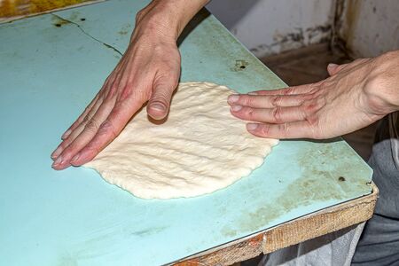 Making Asian flat bread loaf in unsanitary conditionsの写真素材