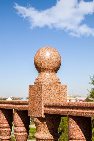 Close-up granite balustrade element against the skyの写真素材