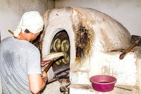 Making Asian flat bread loaf in unsanitary conditionsの写真素材
