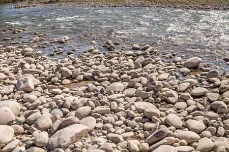 Big Stones on the bank of a mountain riverの写真素材