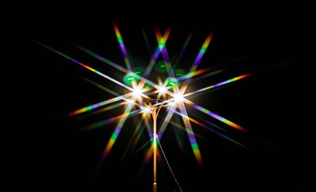 Rainbow bokeh from the light of a street lamp as an abstract backgroundの写真素材