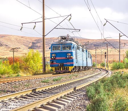 Railway. Train on the railway in the fall.の写真素材