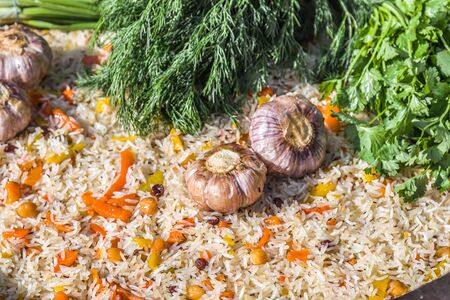 Close-up national pilaf rice dish with spices and fresh herbsの写真素材