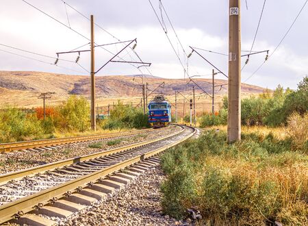 Railway. Train on the railway in the fall.の写真素材