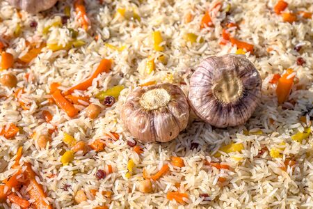Cooking pilaf in a cauldron close-up as a background. National Asian food. Uzbek pilaf.の写真素材