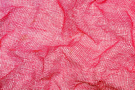 Red mesh fabric as backgroundの写真素材
