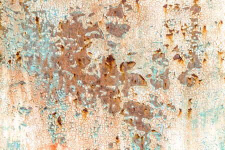 Old cracked paint on a metal surface as a backgroundの写真素材
