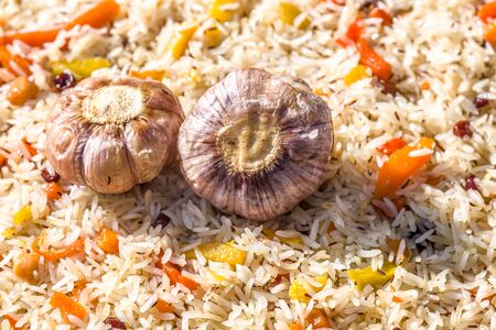 Cooking pilaf in a cauldron close-up as a background. National Asian food. Uzbek pilaf.の写真素材