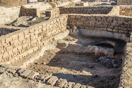 Reconstruction restoration of old clay walls at an archaeological site.の写真素材