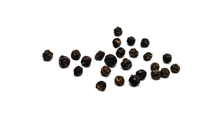 Peas of black allspice close-up on a white background.の写真素材