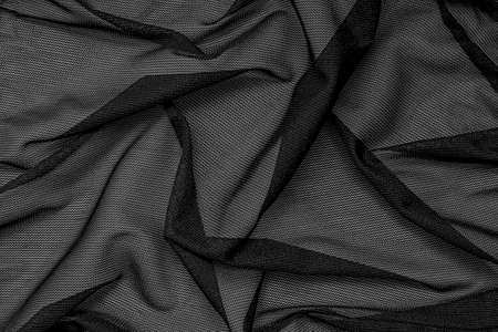 Black mesh fabric as background.の写真素材