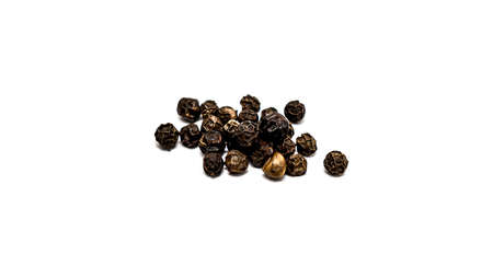 Peas of black allspice close-up on a white background.の写真素材