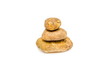 Potato tubers close-up on a white background.の写真素材
