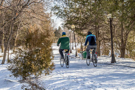 Winter cycling in a city park. Landscape.の写真素材