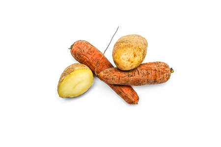 Boiled vegetables in a peel carrots and potatoes on a white backgroundの写真素材