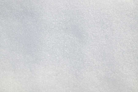 Melting white snow as a backgroundの写真素材