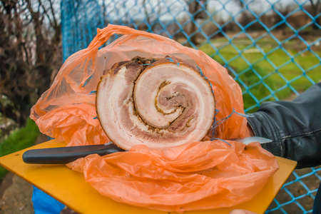 Smoked pork lard roll. Hot smoked pork rollの写真素材