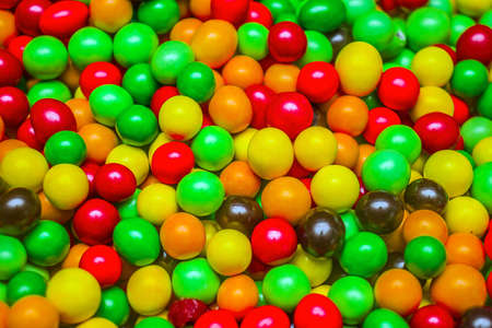 Colorful candy nuts in glaze as abstract backgroundの写真素材