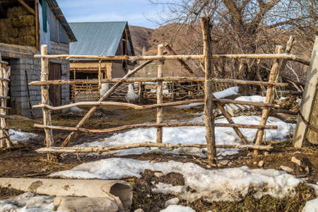 Fence from poles in Kazakhstan in the countrysideの写真素材
