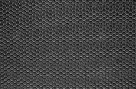 Black mesh metal structure as a backgroundの写真素材