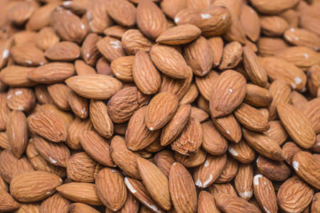 Vegan food. Raw Almond nuts for roasting closeup. natural food background.の写真素材