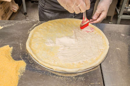 The process of making delicious Italian pizzaの写真素材