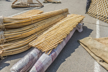 The wooden details of the Asian yurt lie on the pavement. Assembling the yurt.の写真素材