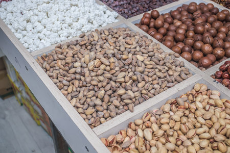 a bunch of different nuts in the oriental marketの写真素材