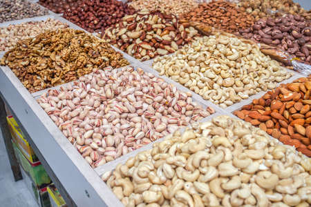 a bunch of different nuts in the oriental marketの写真素材