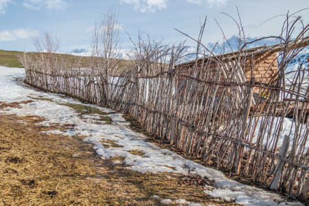 Fence from poles in Kazakhstan in the countrysideの写真素材