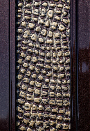 Forged and painted metal gate elements close-up as a background.の写真素材