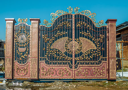 Iron metal gate with forged and painted elements.の写真素材