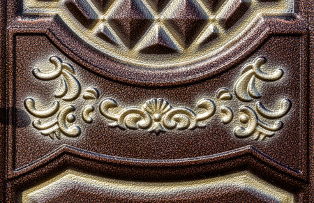 Forged and painted metal gate elements close-up as a background.の写真素材