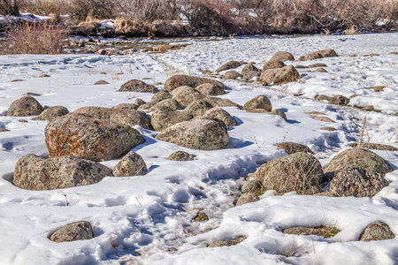 mountain stones. Boulders in the snow in nature. closeup.の写真素材
