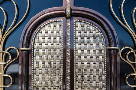 Forged and painted metal gate elements close-up as a background.の写真素材