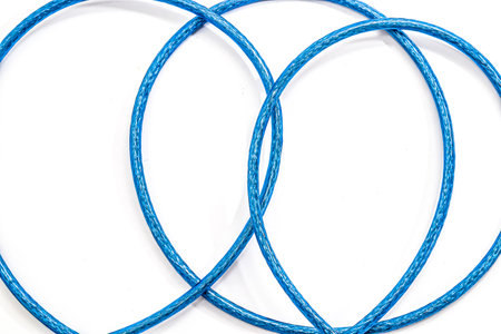 Armored cable with USB connector isolated on a white background.の写真素材