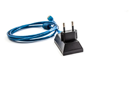 Armored cable with USB connector isolated on a white background.の写真素材