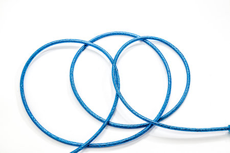 Armored cable with USB connector isolated on a white background.の写真素材