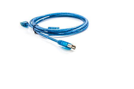 Armored cable with USB connector isolated on a white background.の写真素材