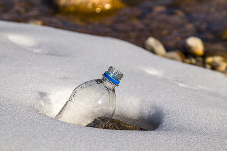 Plastic bottle in the snow in nature.の写真素材