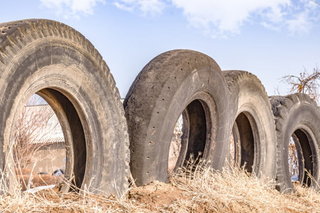 A fence made of old car tires.の写真素材
