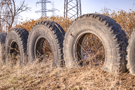 A fence made of old car tires.の写真素材
