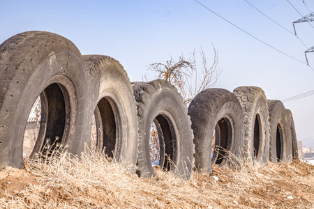 A fence made of old car tires.の写真素材