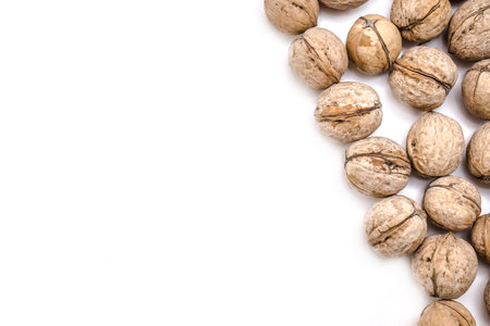 Walnuts in shells isolated on white background.Photo with shallow depth of field.