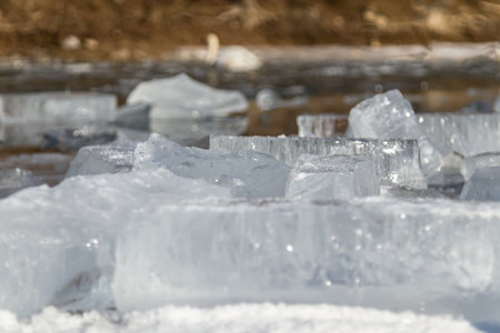 Melting crushed ice in water in natureの写真素材